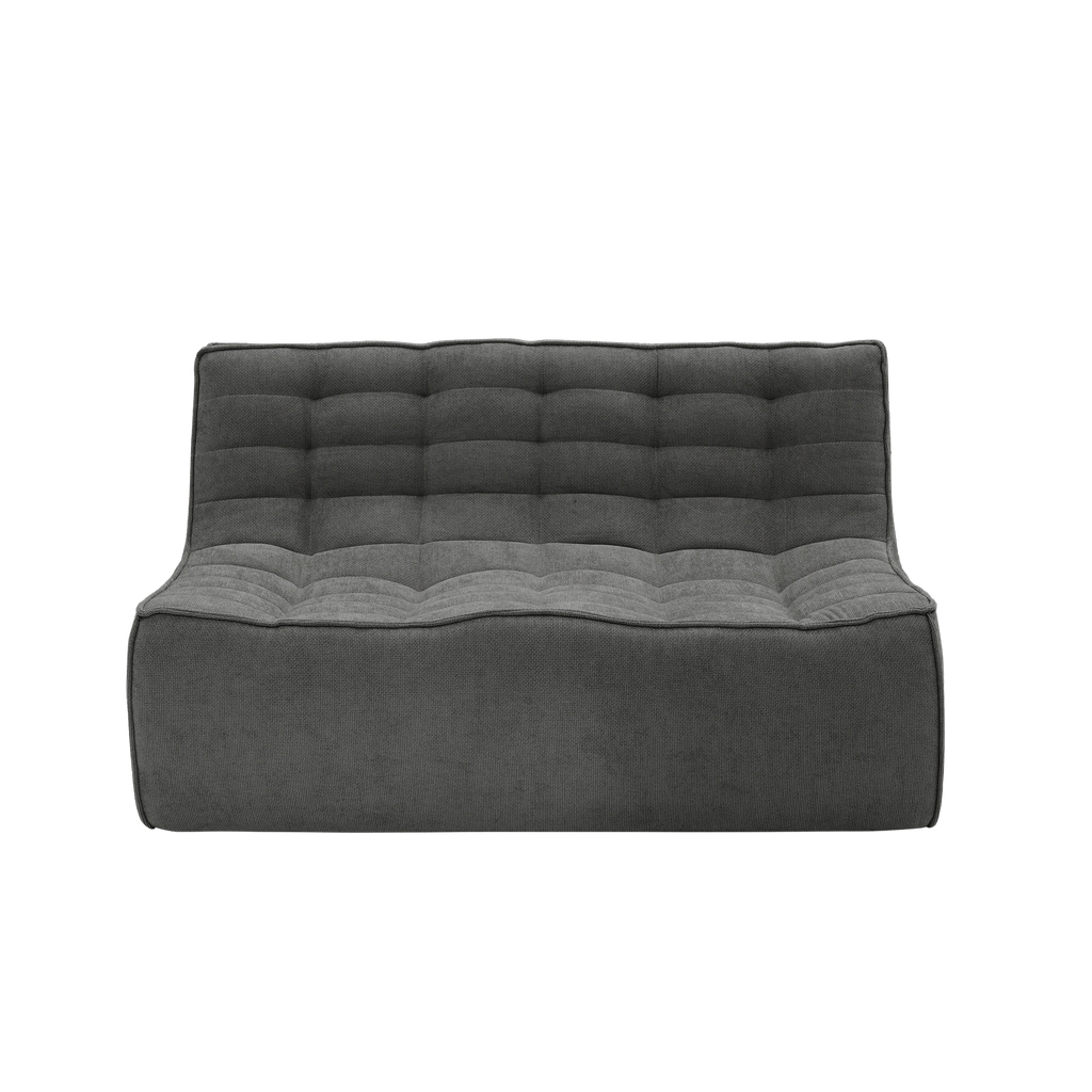 Gray tufted sofa on a white background