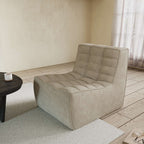 A khaki chenille accent chair with a minimalist design