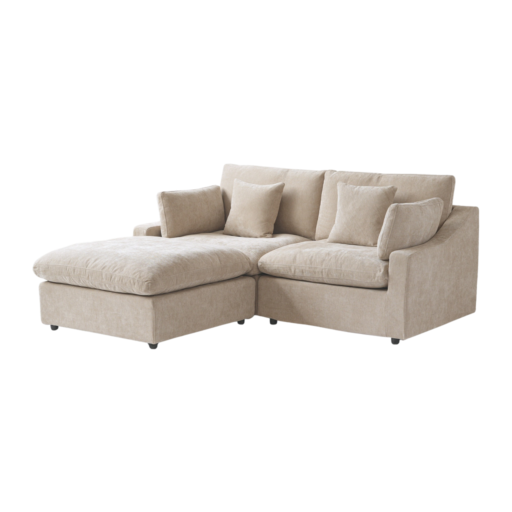 Beige sectional sofa with cushions on a white background