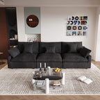 A modern black 3-seater sectional sofa with washable cushions and pillow covers, placed in a room with a minimalist design.