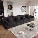 A black washable cloud sectional 4-seat sofa with removable cushions and pillow covers, arranged in a living room setting.