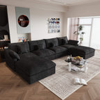 A large black U-shaped sectional sofa with removable cushions and pillow covers, placed in a modern living room setting.