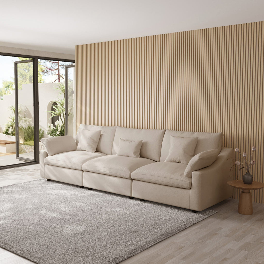 Khaki 3-seater sofa in a modern living room with a striped wall and large windows.