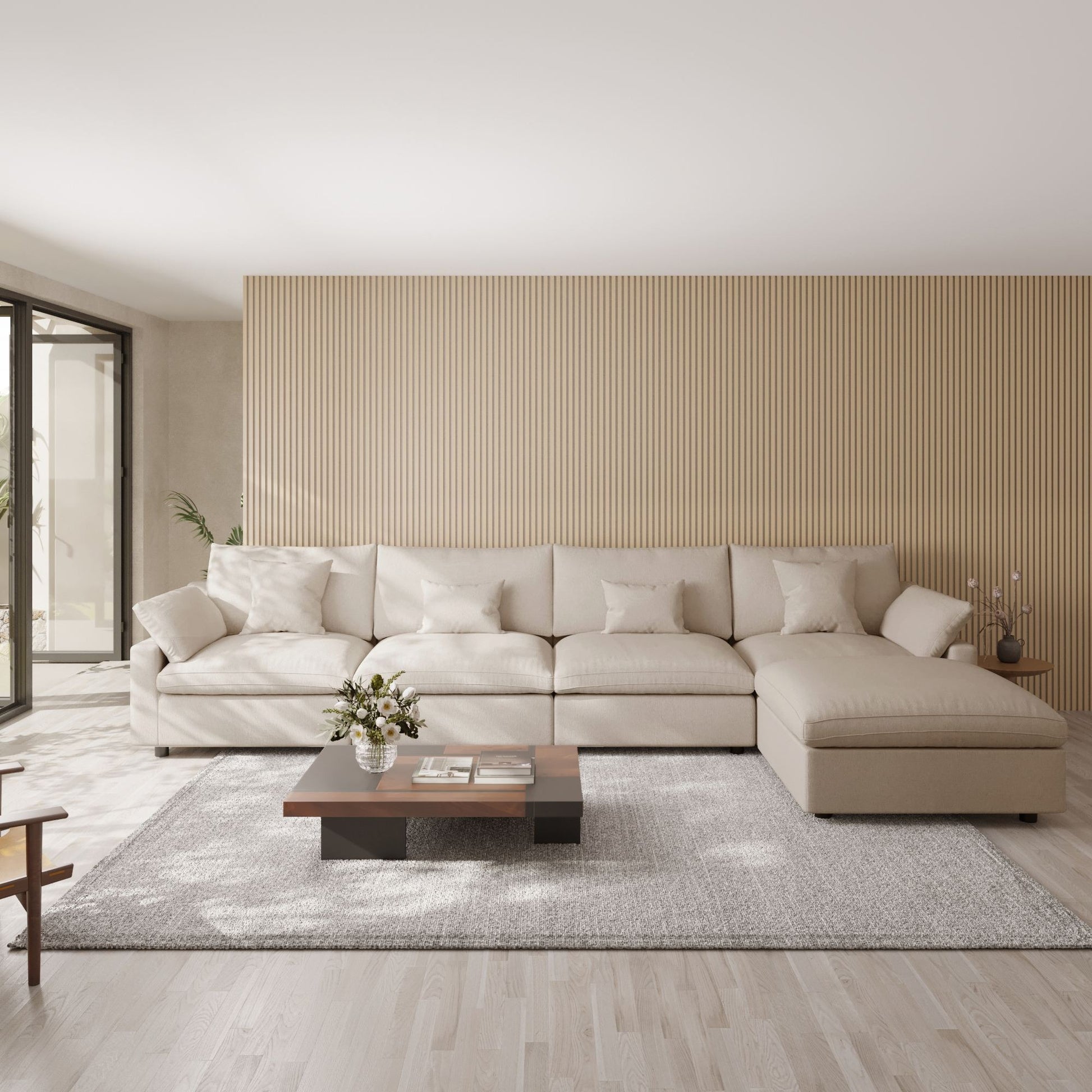 Modern living room with a khaki 5-seat sectional sofa with ottoman, wooden coffee table, and striped wall.