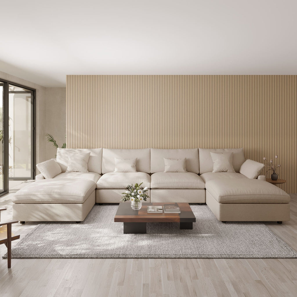 Khaki U-shaped sectional sofa in a modern living room with a striped wall and wooden coffee table.