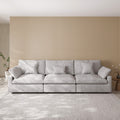 Light gray 3-seater sofa in a room with a striped wall and rug