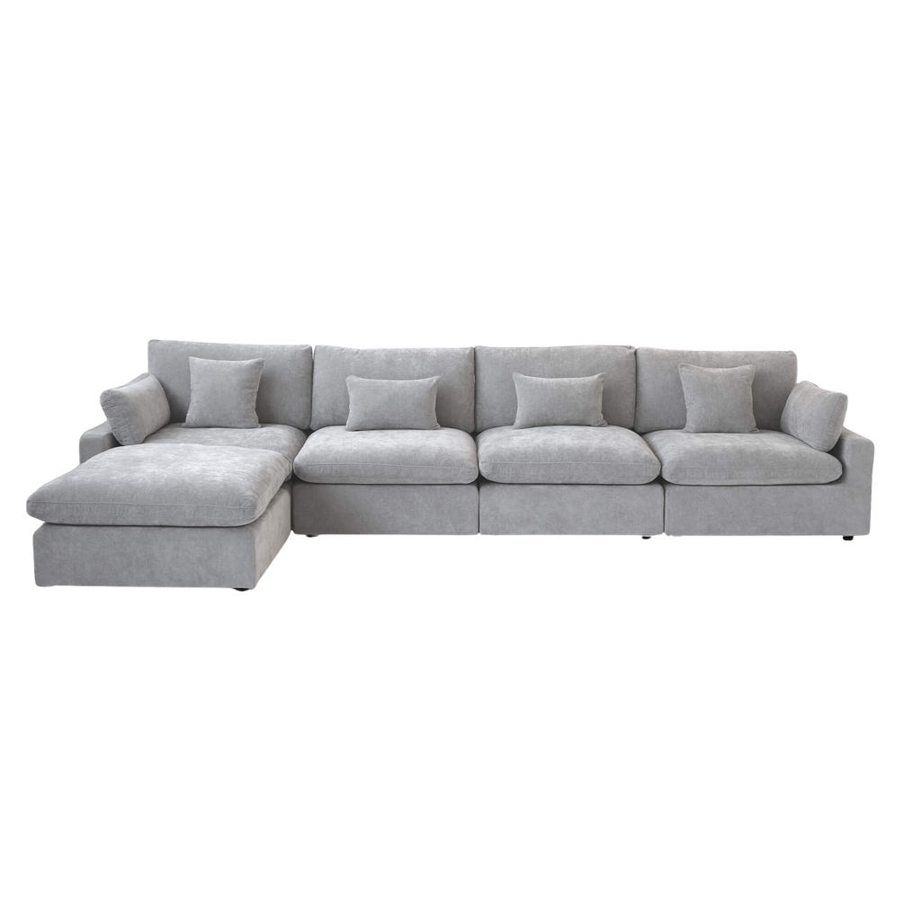 Light gray sectional 4-seat sofa with ottoman on a white background