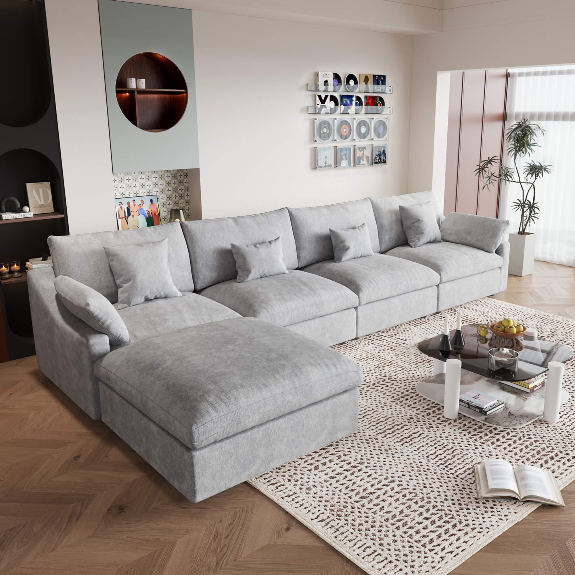 A large, light gray washable cloud 5-seat sectional sofa with removable cushions and an ottoman, placed in a living room setting.