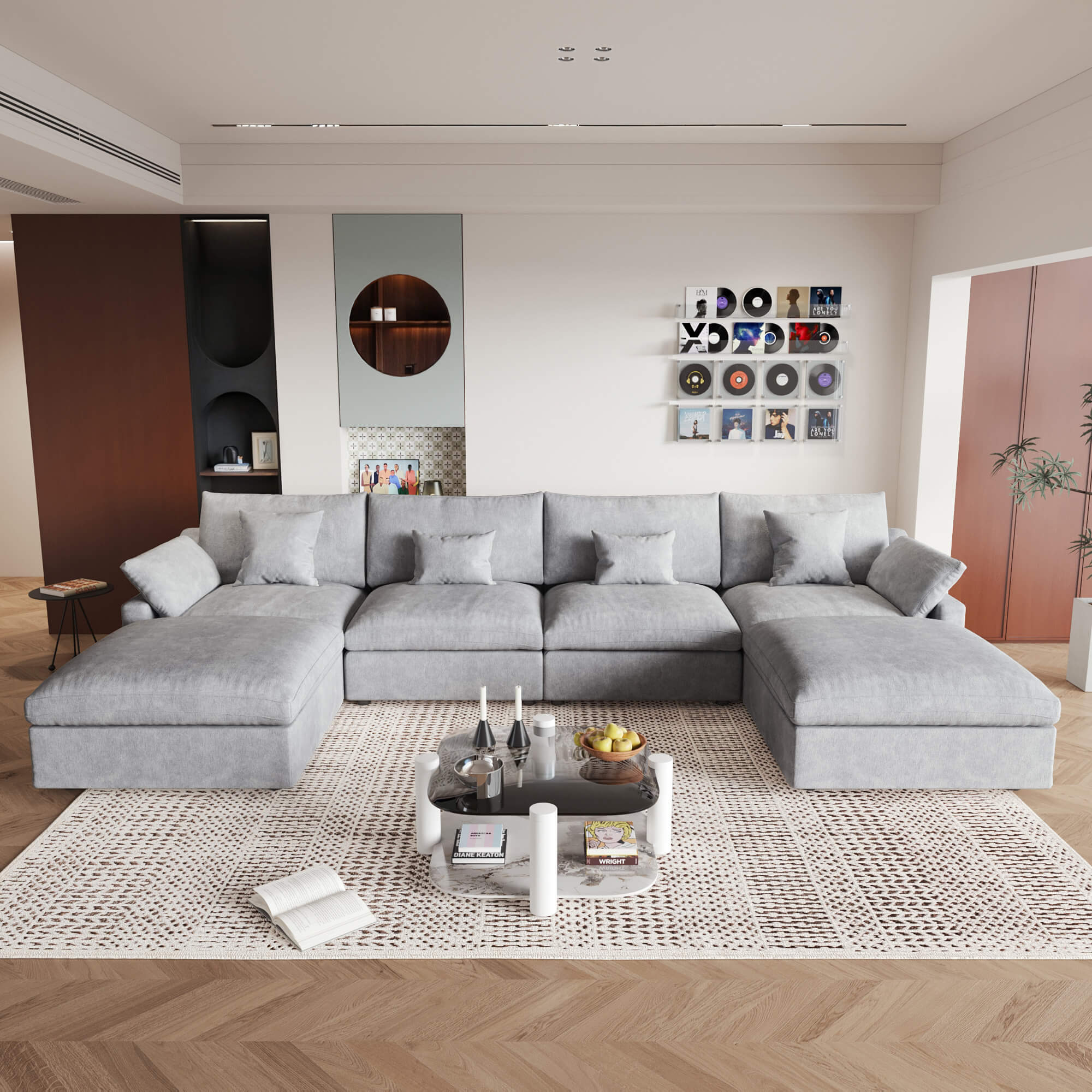 A large light gray U-shaped sectional sofa with removable cushions and pillow covers, placed in a modern living room setting.