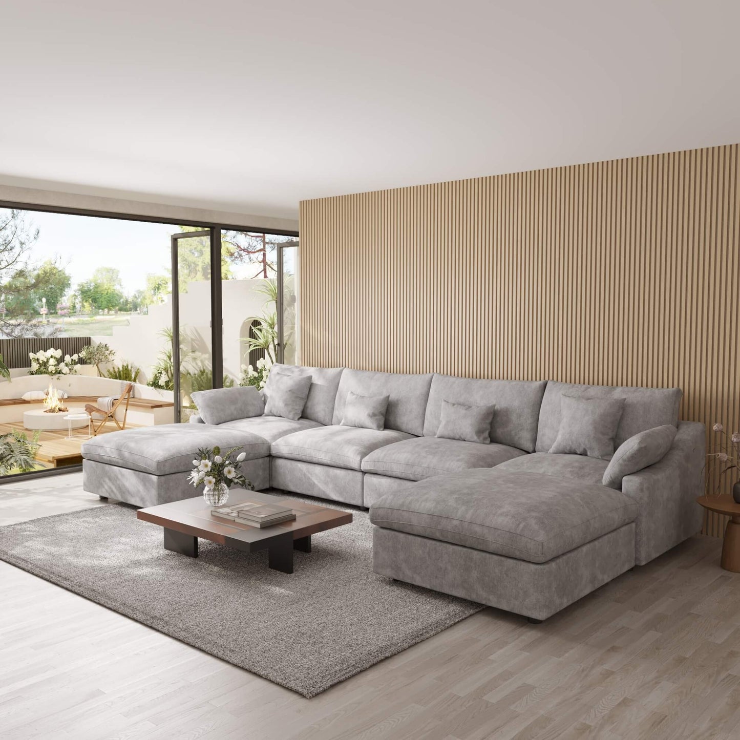 Light gray U-shaped sectional sofa in a modern living room with wooden coffee table and striped wall.