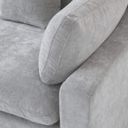 Close-up of a corner seat of a gray couch