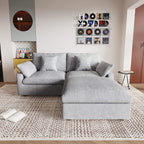A light gray linen loveseat with ottoman, featuring a washable cloud design, placed on a patterned rug in a room with a record collection on the wall.