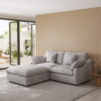 Light gray sectional chaise lounge sofa in a modern living room with a striped wall and patio door.