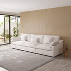 White White 3-seater sofa in a modern living room with a wooden accent wall.