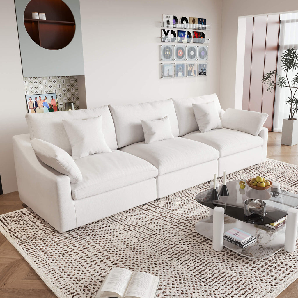 A modern white 3-seater sectional sofa with washable cushions and pillow covers, placed in a room with a minimalist design.