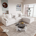 An L-shaped white sectional sofa with removable cushions and pillow covers, placed in a living room setting.