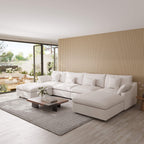 Modern living room with a white U-shaped sectional sofa, wooden coffee table, and decorative elements.