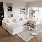A large white U-shaped sectional sofa with removable cushions and pillow covers, placed in a modern living room setting.