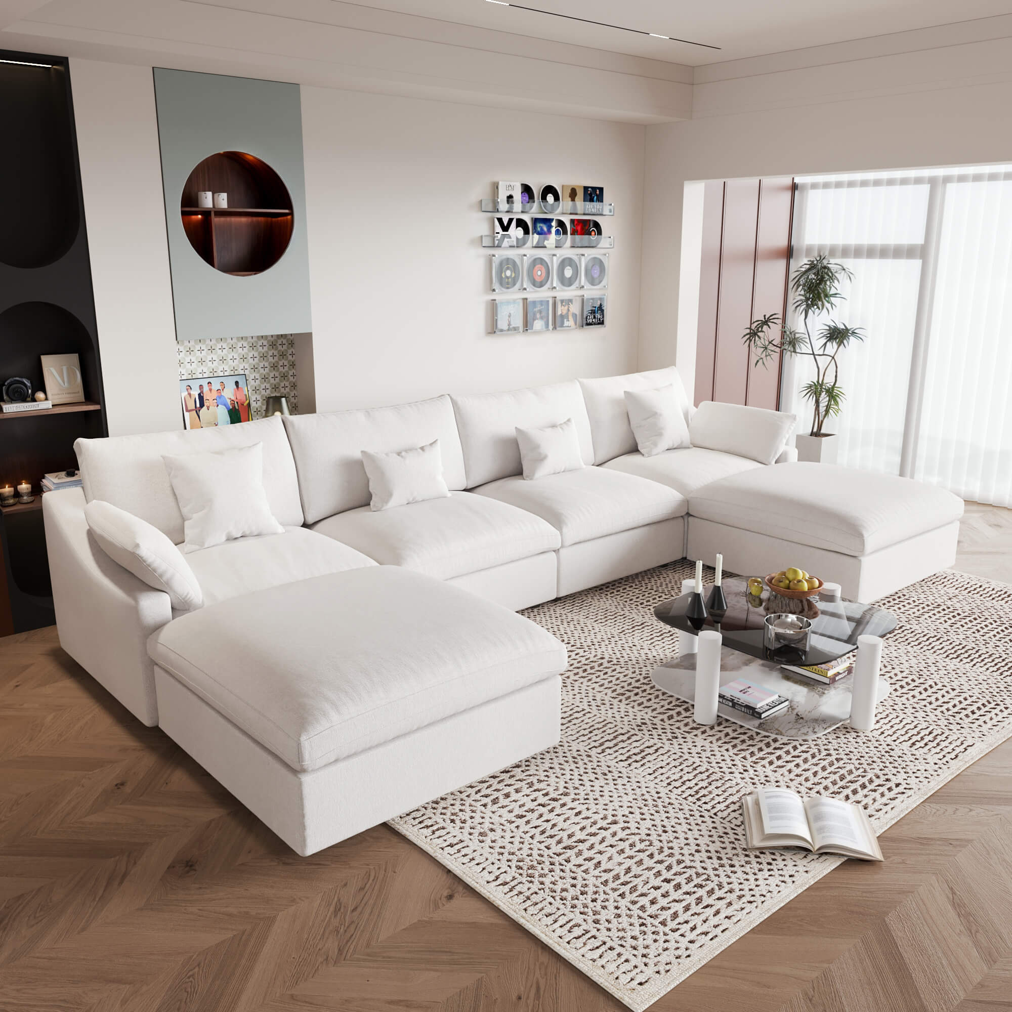 A large white U-shaped sectional sofa with removable cushions and pillow covers, placed in a modern living room setting.