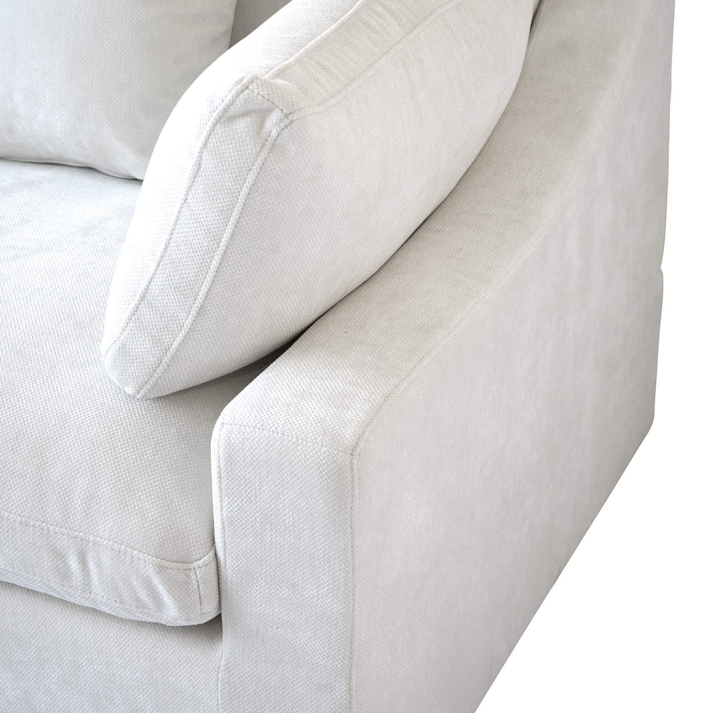 Close-up of a slope armrest design of a white sofa