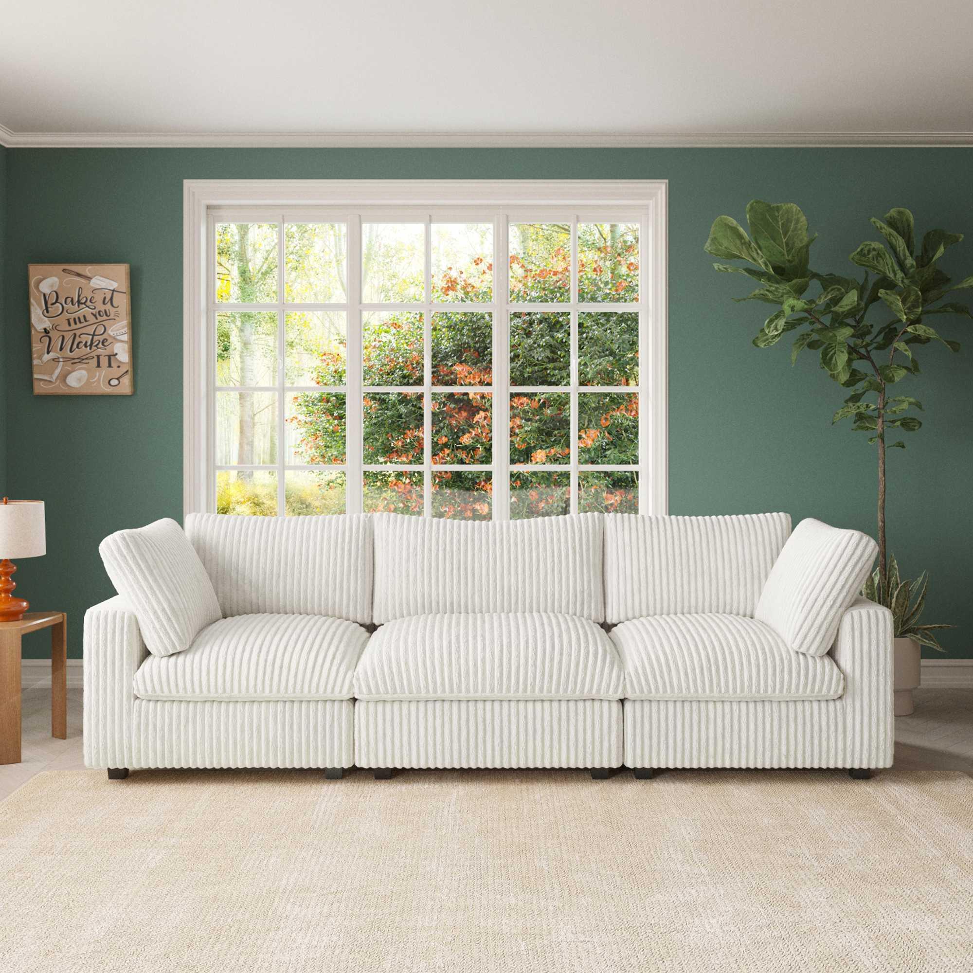 A white faux rabbit fur sectional sofa with striped patterns, arranged as a 3-seater in a living room setting.
