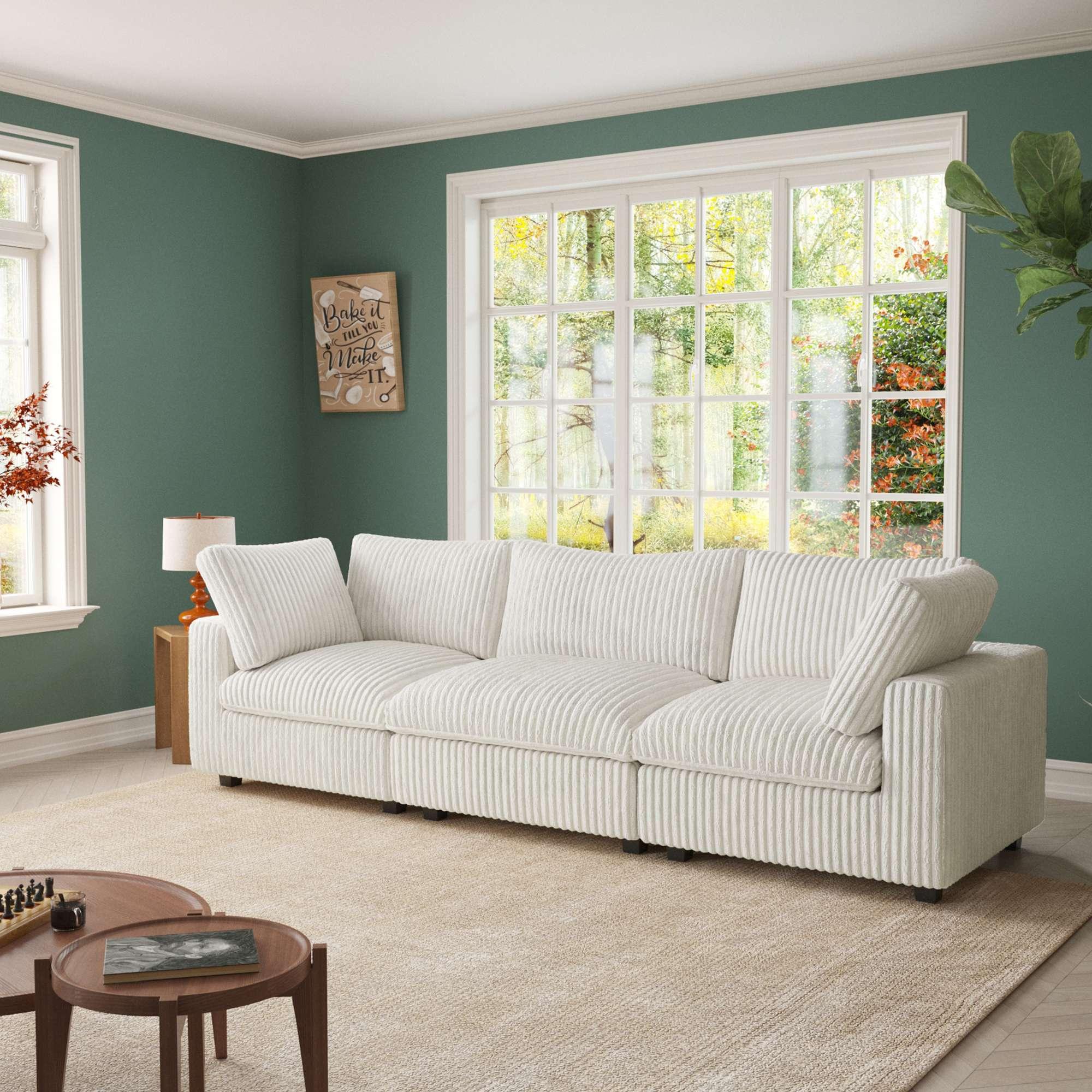 A beige faux rabbit fur sectional sofa with striped patterns, arranged as a 3-seater in a living room setting.
