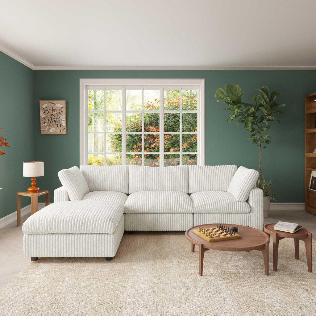A beige L-shaped faux rabbit fur sectional sofa with removable covers, shown in a living room setting with striped fabric, light color scheme, and modern aesthetic.