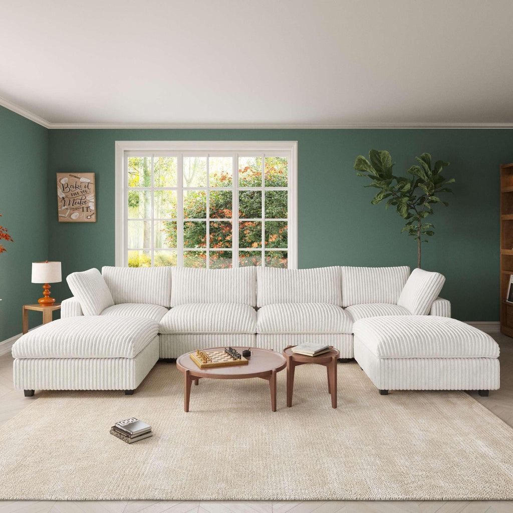 A white, U-shaped faux fur sectional sofa with removable covers, shown in a living room setting with a modern interior.