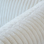 Close-up of a faux rabbit fur fabric of a beige sofa