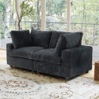 Black faux rabbit fur 2-seater with washable slipcovers.