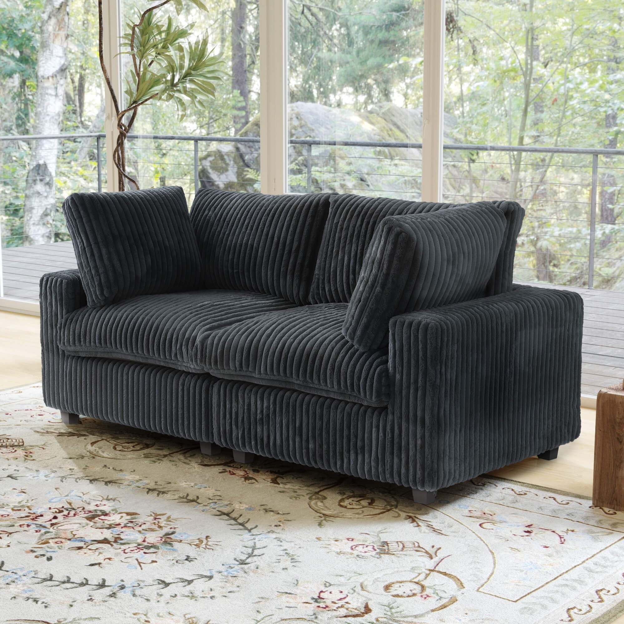 Black faux rabbit fur 2-seater with washable slipcovers.