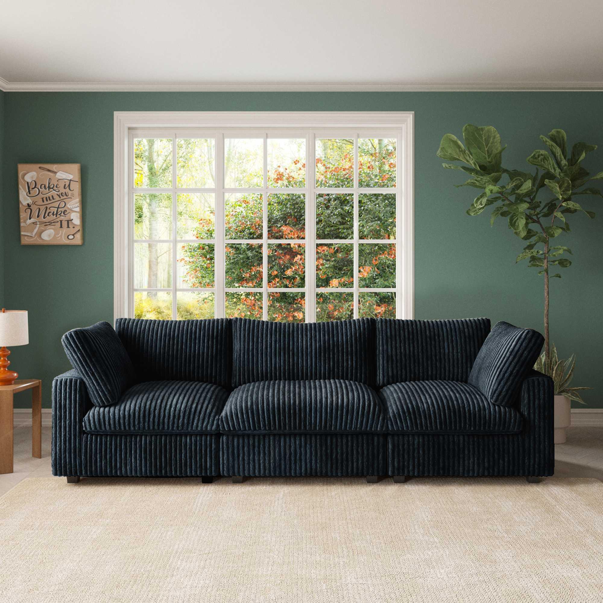 A black faux rabbit fur sectional sofa with striped patterns, arranged as a 3-seater in a living room setting.