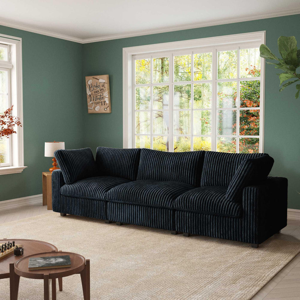 A black faux rabbit fur sectional sofa with striped patterns, arranged as a 3-seater in a living room setting.