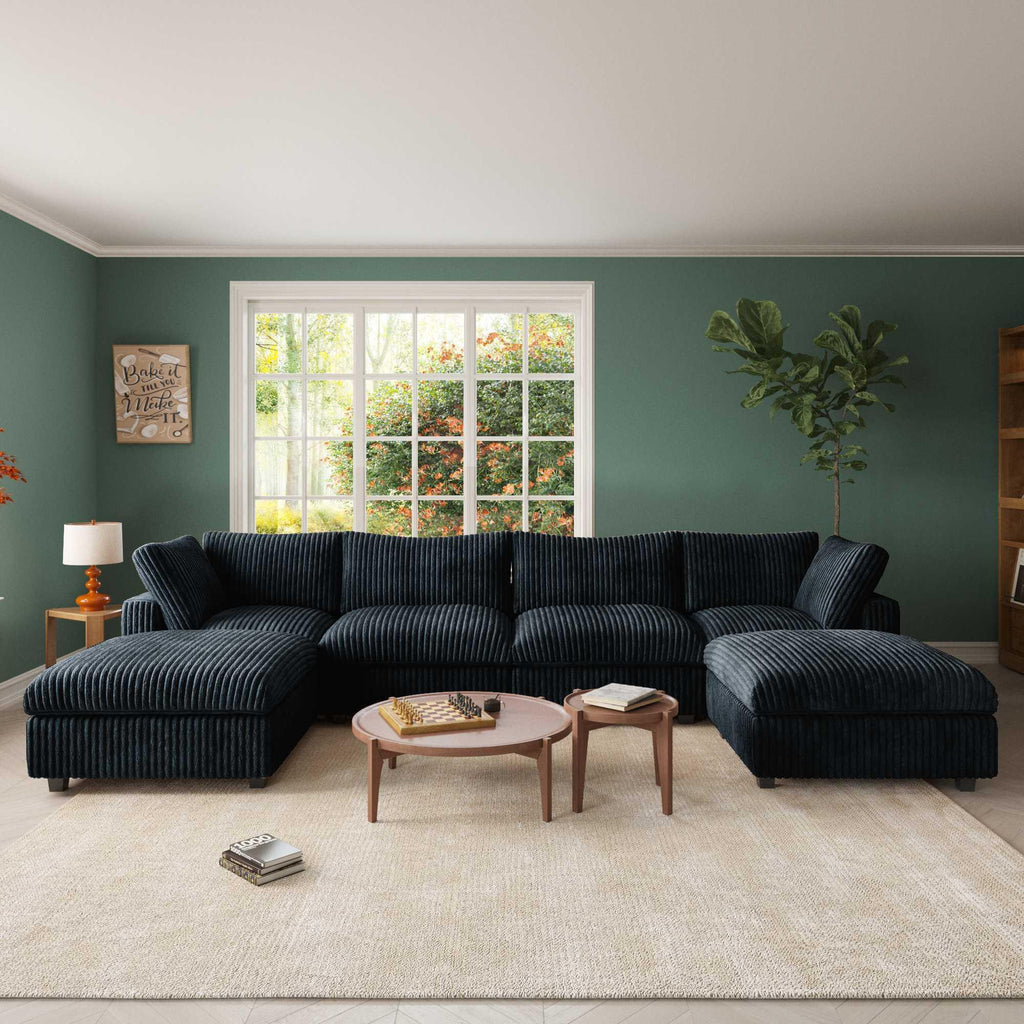 A black, U-shaped faux rabbit fur sectional sofa with removable covers, shown in a living room setting with a modern interior.