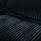 Close-up of a seat of a black faux fur sofa