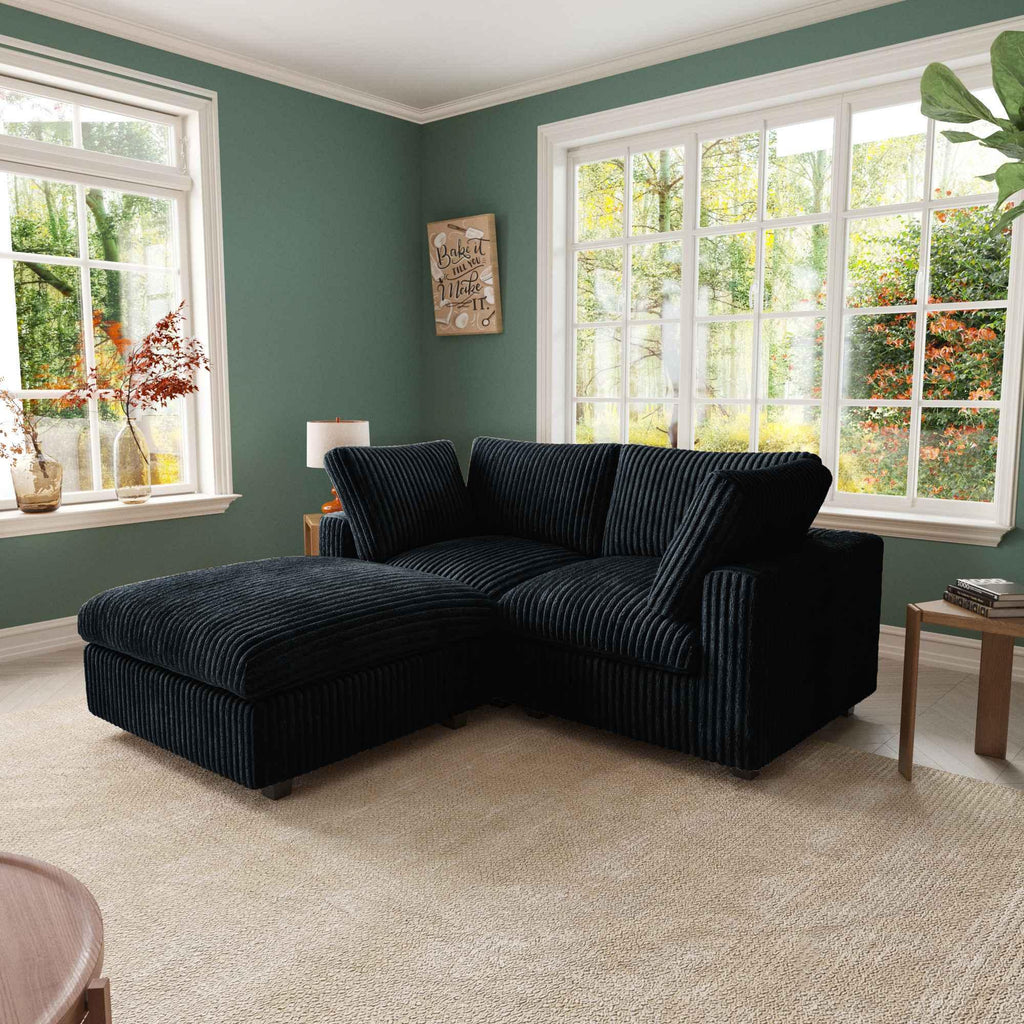 Black compact 2-seater with ottoman upholstered in faux rabbit fur