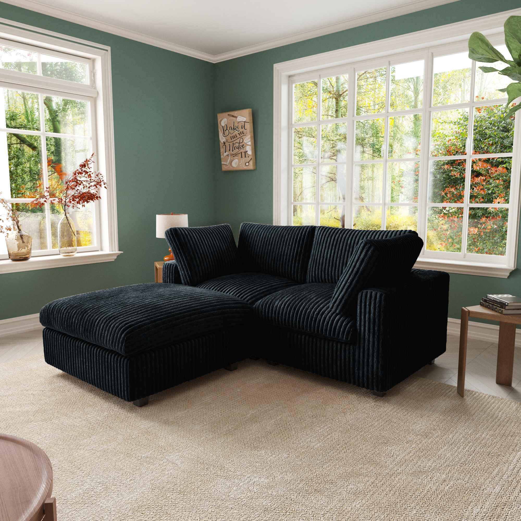 Black compact 2-seater with ottoman upholstered in faux rabbit fur