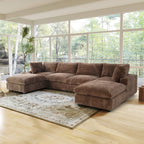 Brown U-shaped sectional sofa in a living room with large windows and a rug.