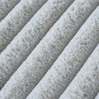 Close-up of gray textured fabric with a ribbed pattern
