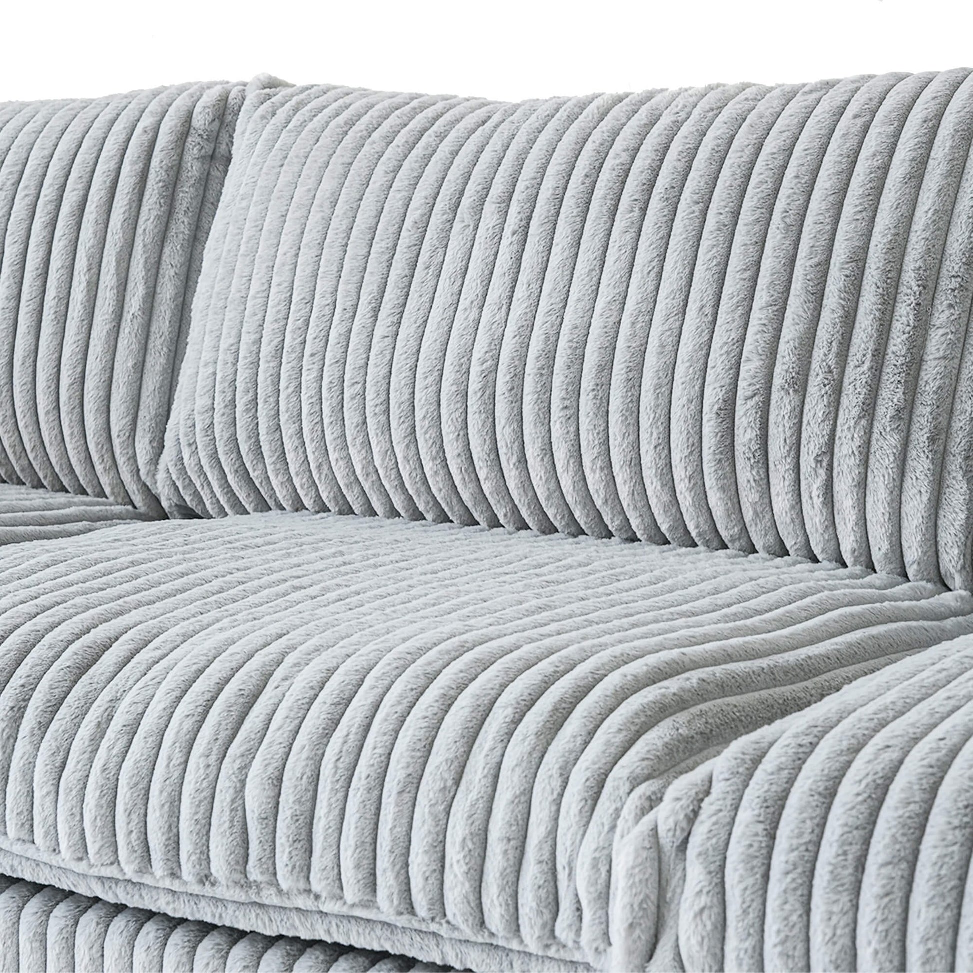 Gray faux rabbit fur sofa with a close-up view of the fabric pattern.