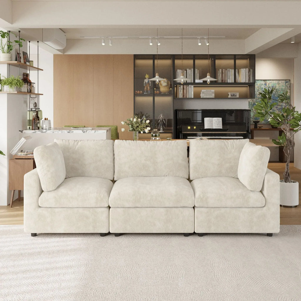 Beige 3-seater sofa in a modern living room with decor elements.
