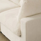 Close-up of a beige sofa with a textured fabric surface.