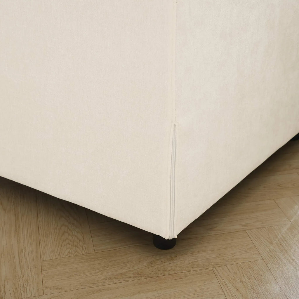 Beige upholstered sofa frame corner on a wooden floor