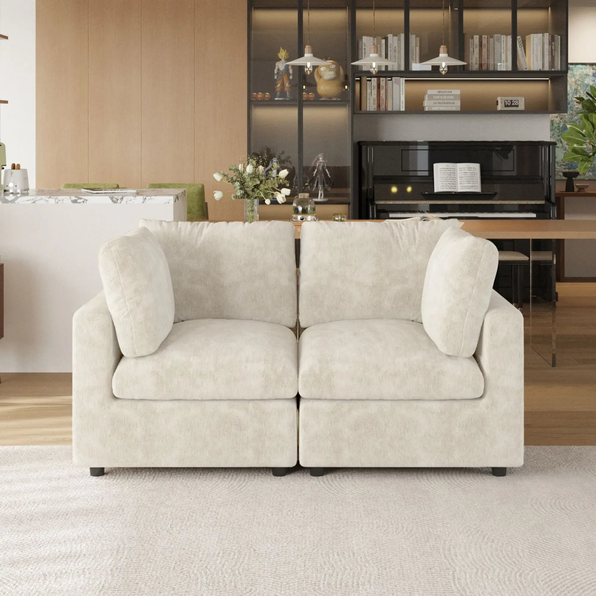 Beige sofa in a living room setting with a piano and bookshelf in the background.