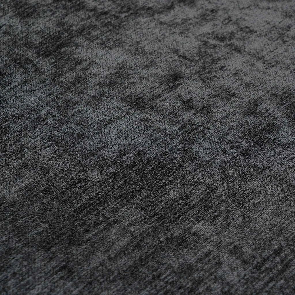 Close-up of a textured black fabric surface