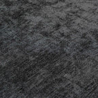 Close-up of a textured black fabric surface