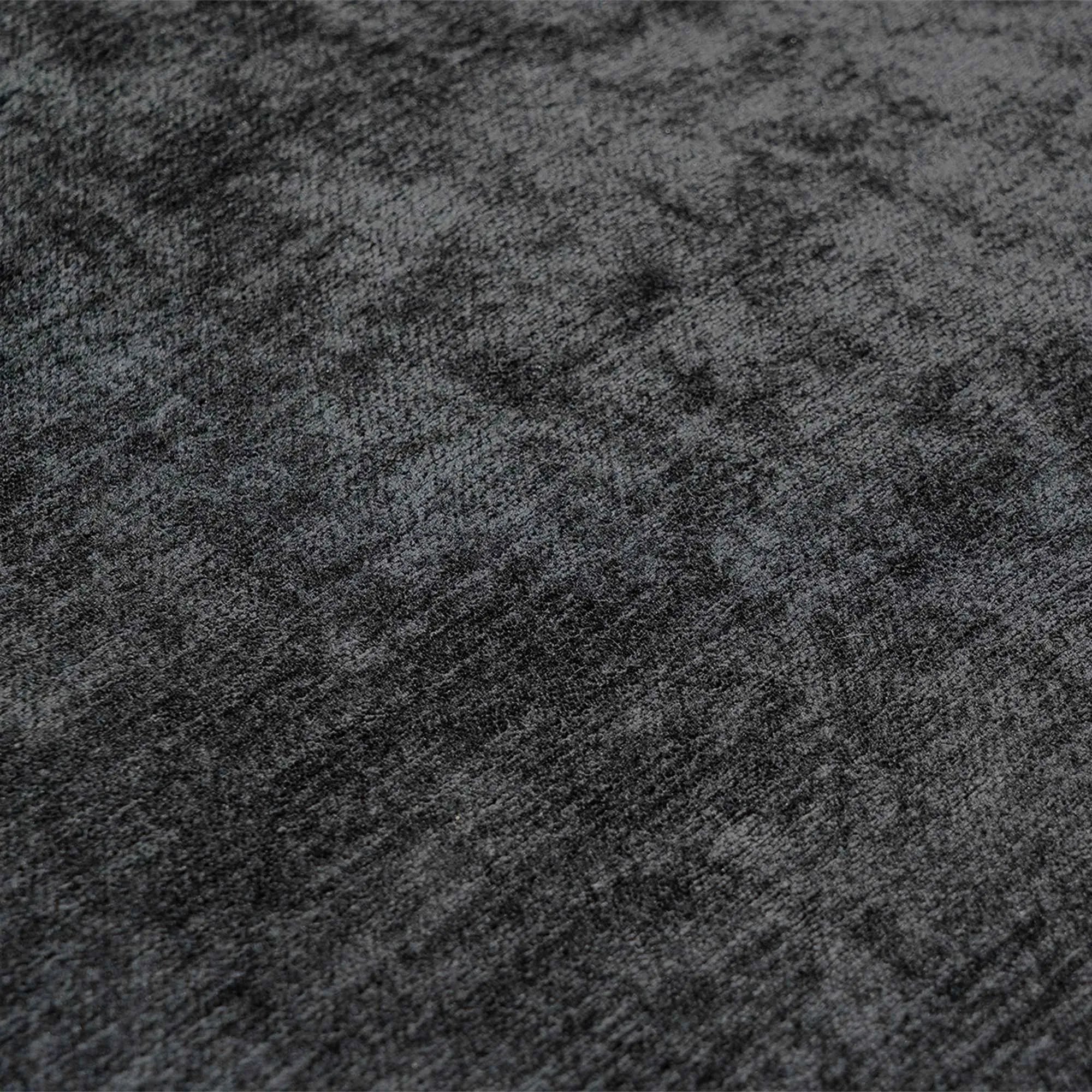 Close-up of a textured black fabric surface