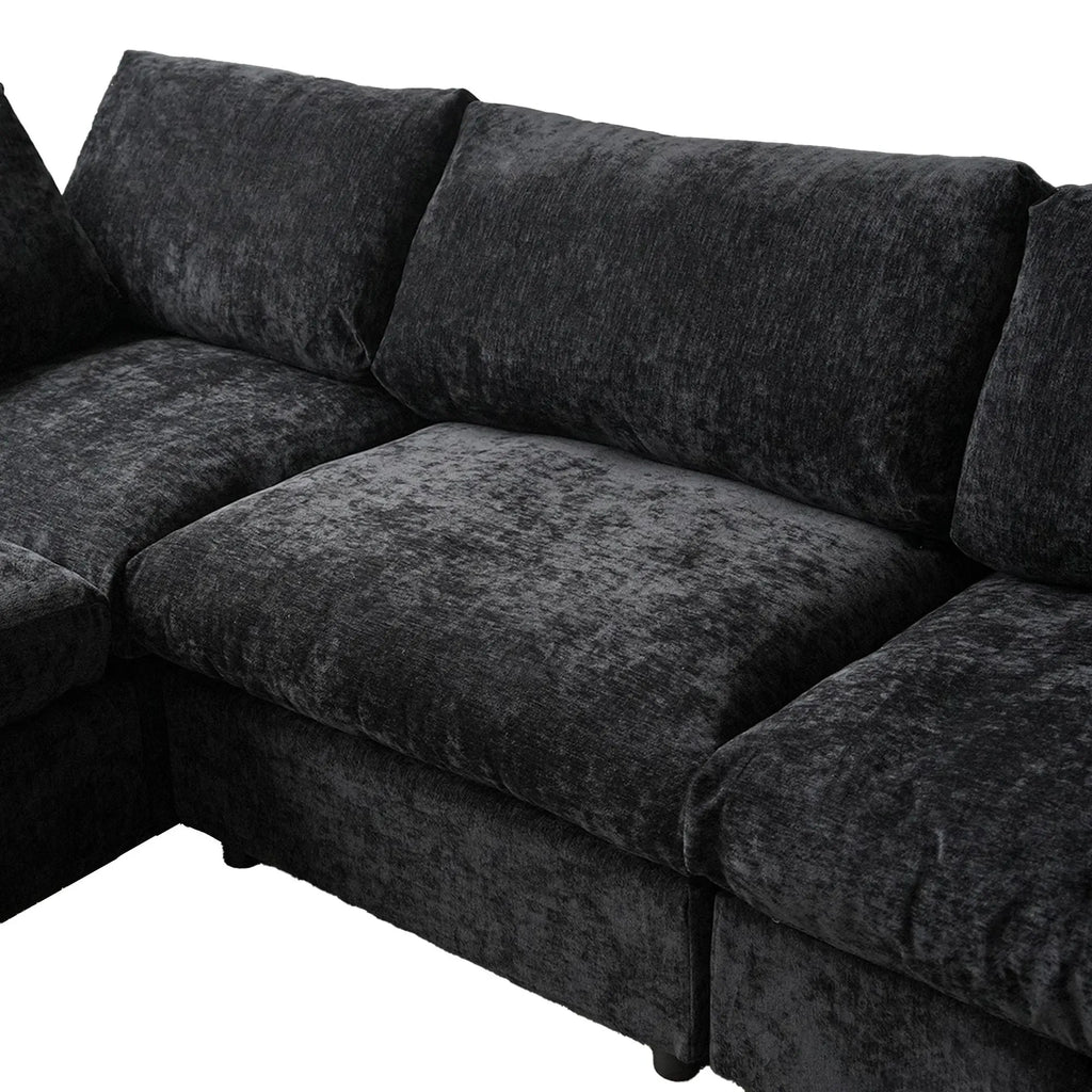 Black sectional sofa on a white background