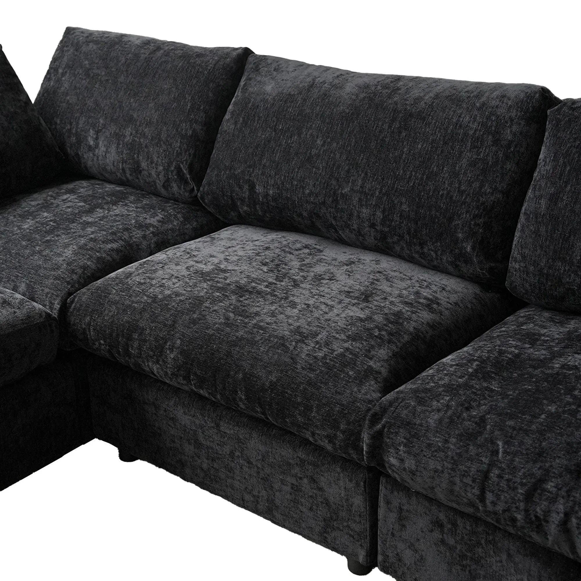 Black sectional sofa on a white background