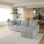 Gray L-shaped 4-seater sectional sofa in a modern living room with kitchen in the background